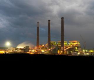 Coal-fired power plant by night