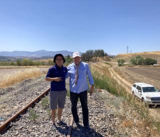Georgia Tech scientist Zhigang Peng posing with TUBITAK scientist Ekrem Zor right in front of a possible surface rupture produced by the 2023 magnitude 7.8 earthquake
