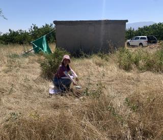Georgia Tech graduate student Chang Ding pointing at a deployed seismic node in Southern Turkey
